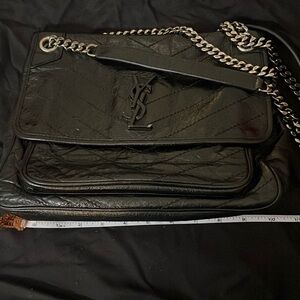 This a vintage YSL Nikki shoulder bag.